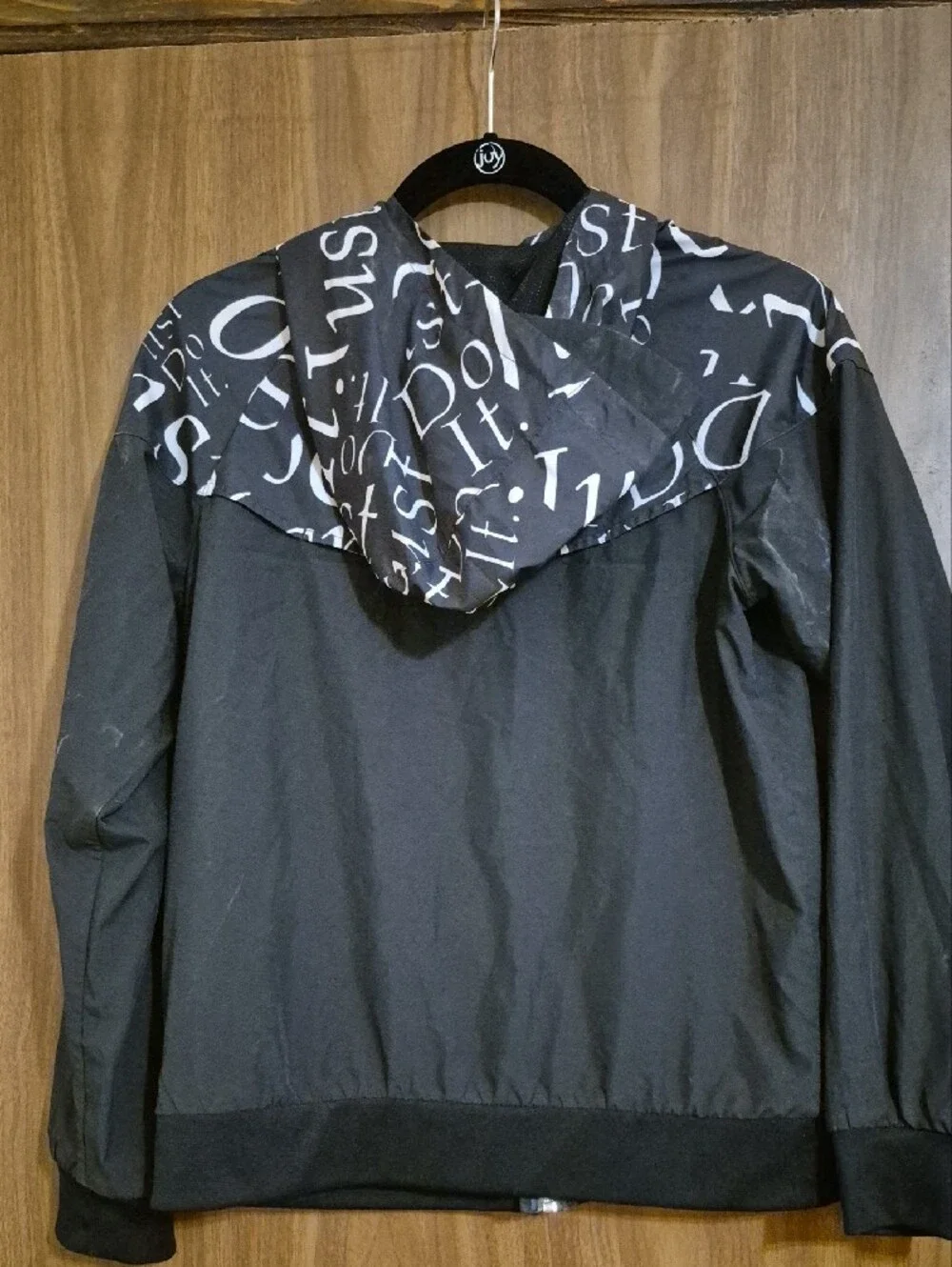 Nike Kids Black Hooded Windbreaker Jacket with White Script Accent